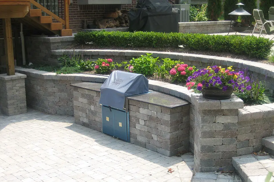 Enhance an Outdoor Kitchen with Softscape and Hardscape - With the Help of Visionary Landscaping